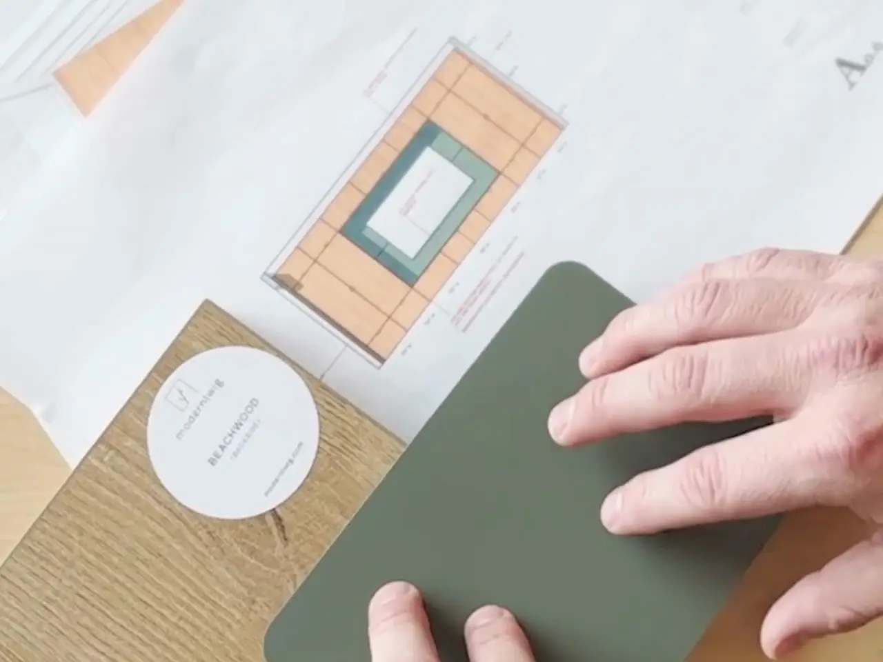 The design process with Beachwood, Verde samples, and mockup of living room storage cabinets