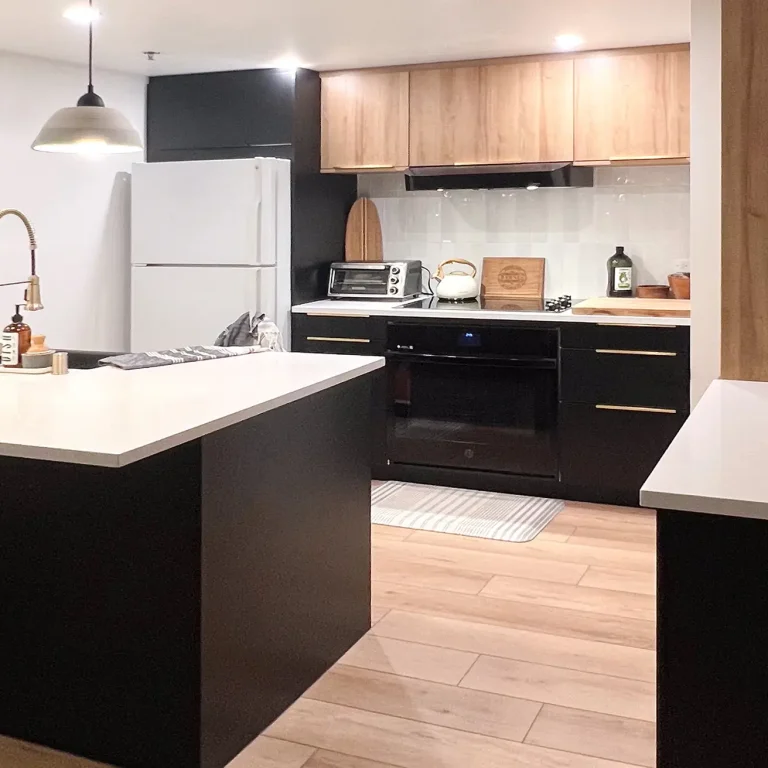 Kitchen cabinets in Beachwood and Black Slab door fronts