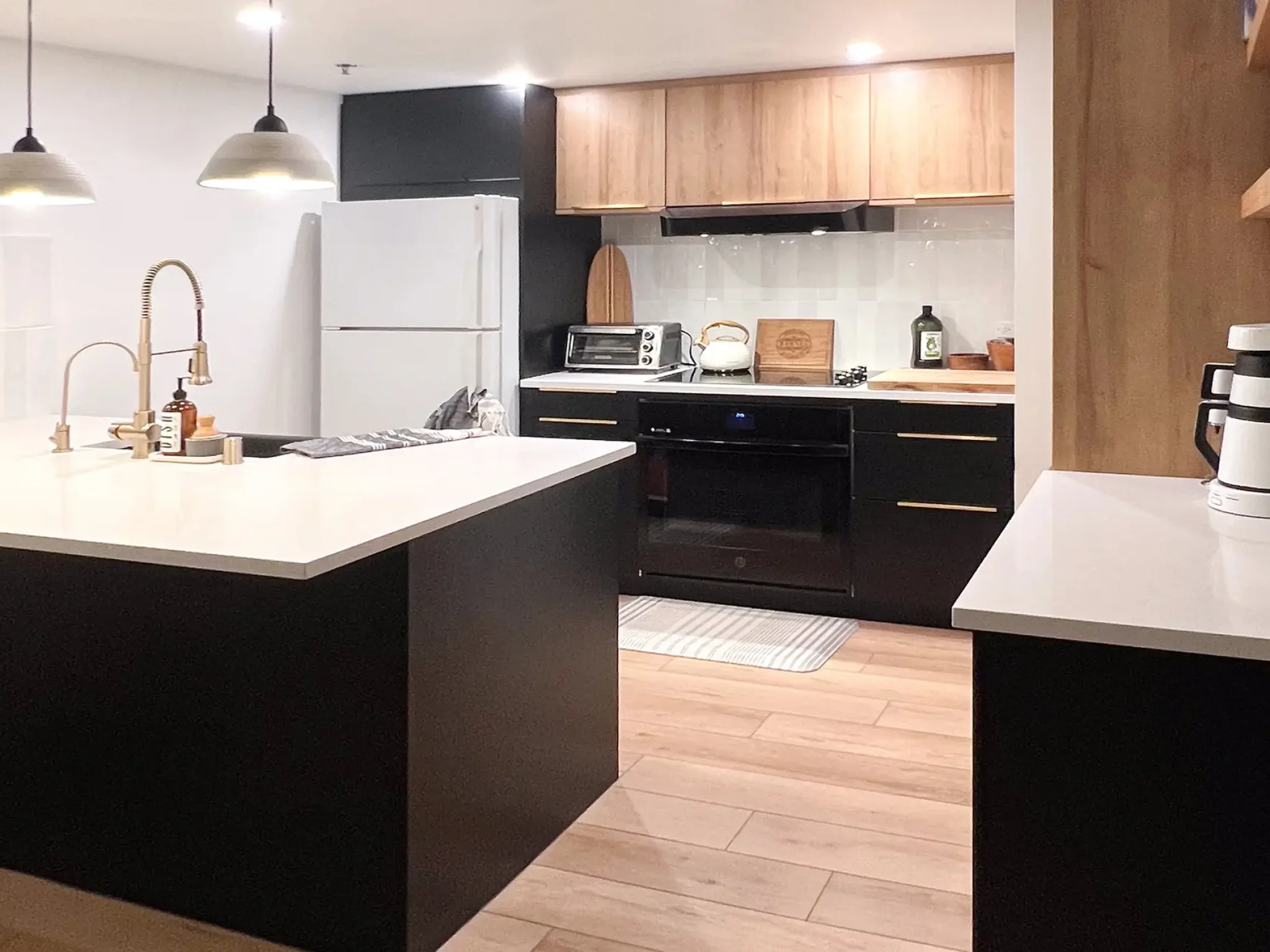 Kitchen cabinets in Beachwood and Black Slab door fronts